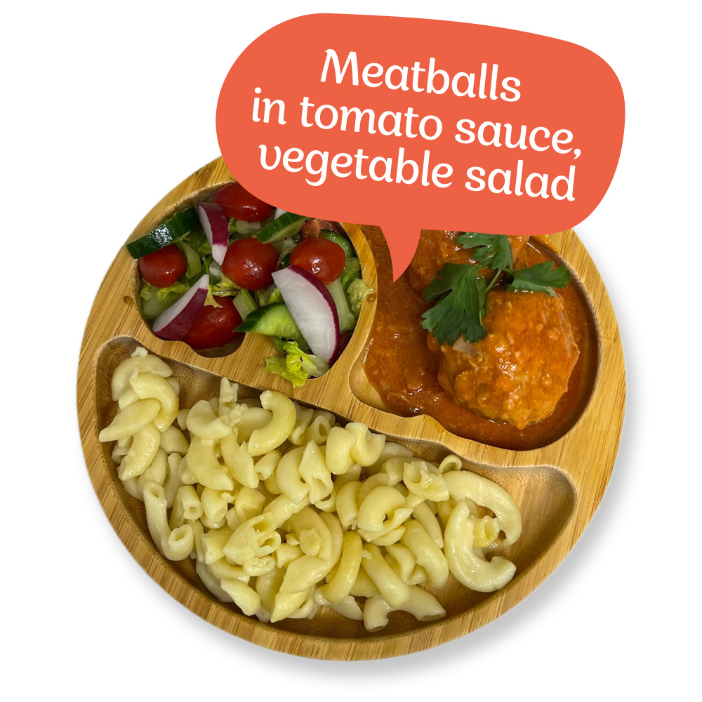 Meatballs in tomato sauce, fresh vegetable salad