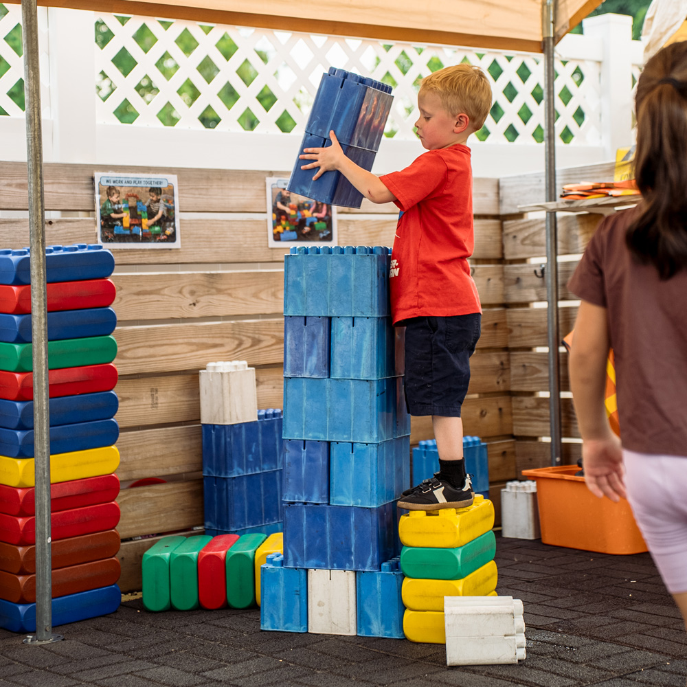 Outdoor blocks, transportation and dramatic play center at Baby Genius Daycare