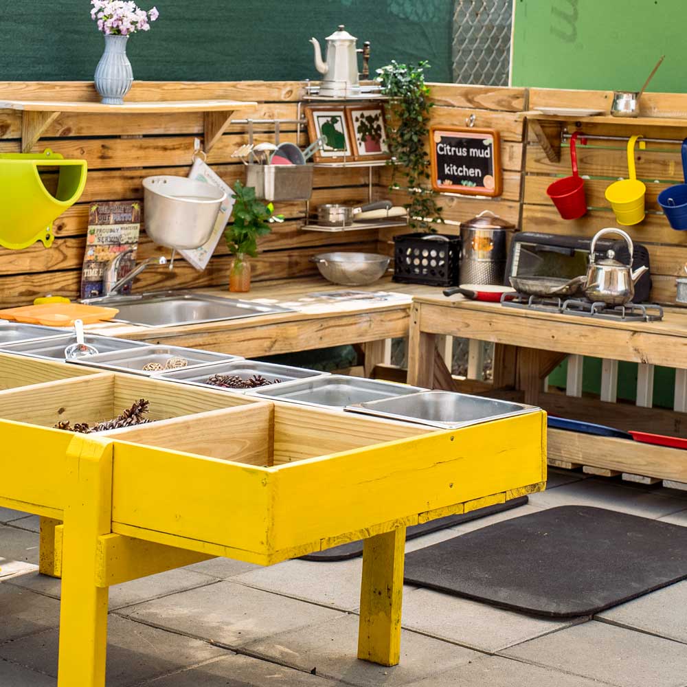 Outdoor mud kitchen for sensory and imaginative play at Baby Genius Daycare in Langhorne